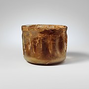 Glass cup with indented sides