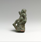 Bronze statuette of Eros seated on a rock