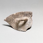 Terracotta rim, handle, and upper body of a bowl