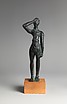 Reproduction of a bronze votive statuettte of a man