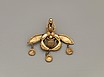 Reproduction of a gold bee pendant
