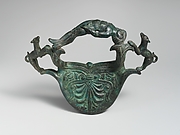 Bronze handle with dogs flanking a reclining youth