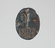 Haematite intaglio: Youth on inscribed stele