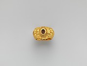 Gold ring with embossed satyr masks: on carnelian intaglio, bird