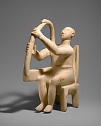Marble seated harp player