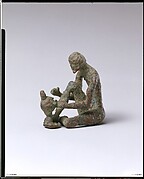 Bronze armorer working on a helmet