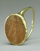 Gold ring with carnelian intaglio: winged Nemesis