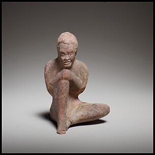 Terracotta statuette of a seated African (known as Ethiopian) boy