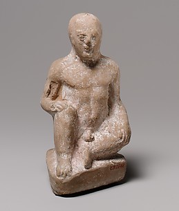 Terracotta statuette of a seated boy