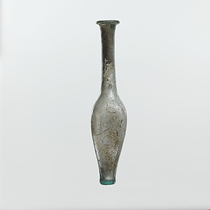 Glass bottle with indented sides