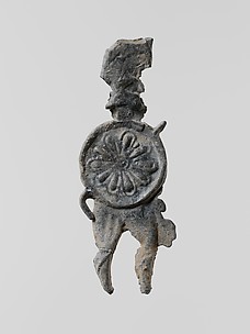 Lead figure of a warrior with a helmet, shield, and spear