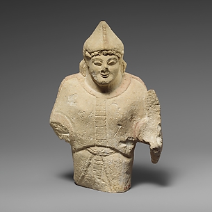 Limestone statuette of a warrior holding a shield
