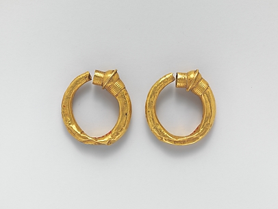Gold trumpet-shaped earrings