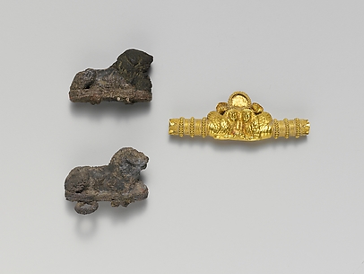 Two silver clasps with lions