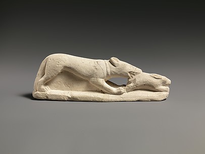 Limestone statuette of a coursing hound seizing a hare