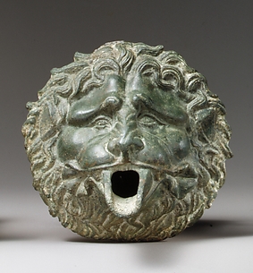 Bronze water spout in the form of a lion mask (one of a pair)