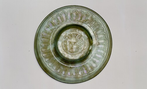 Small glass plate with head of Medusa