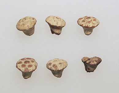Pendant of gilded clay