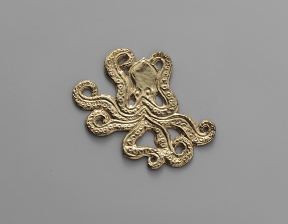 Reproduction of a gold octopus ornament