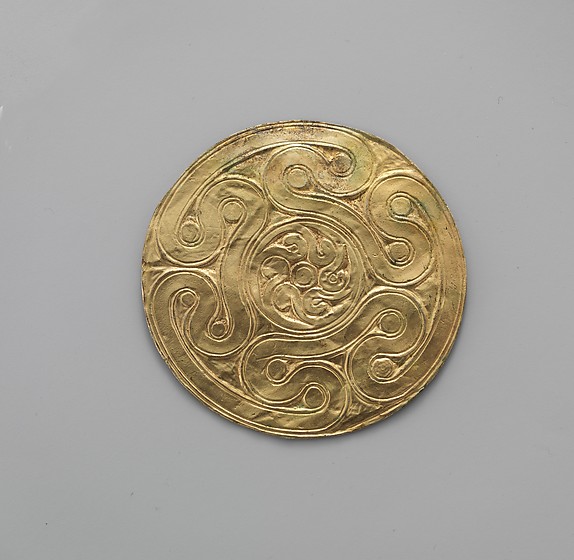 Reproduction of a gold disk ornament with spirals