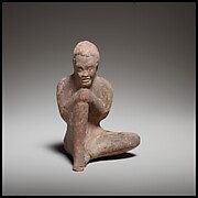 Terracotta statuette of a seated African (known as Ethiopian) boy