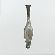 Glass bottle with indented sides