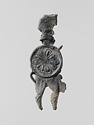 Lead figure of a warrior with a helmet, shield, and spear