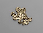 Reproduction of a gold octopus ornament