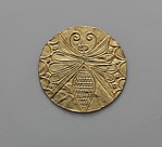 Reproduction of a gold disk with an embossed butterfly