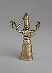 Reproduction of a fake gold snake goddess statuette