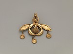 Reproduction of a gold bee pendant