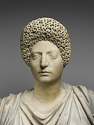 Marble statue of Tyche-Fortuna restored with the portrait head of a woman