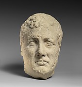 Limestone head of beardless male votary