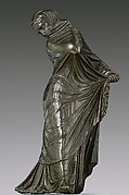 Bronze statuette of a veiled and masked dancer