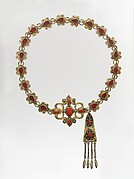 Ornamental elements assembled as a belt