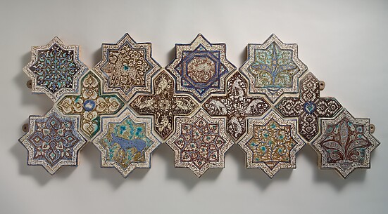 Panel Composed of Cross- and Star-shaped Tiles