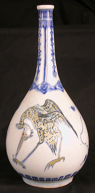 Bottle Depicting Storks in Blue and Yellow on a White Background