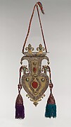 Cordiform pendant with tassles