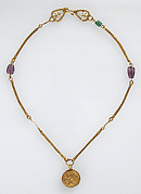 Gold Necklace with Gold Cross, Two Amethysts, and an Emerald Plasma