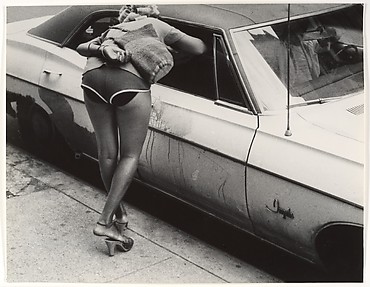 [Street Scene: Woman in Shorts Leaning into Window of Parked Car, New York City]