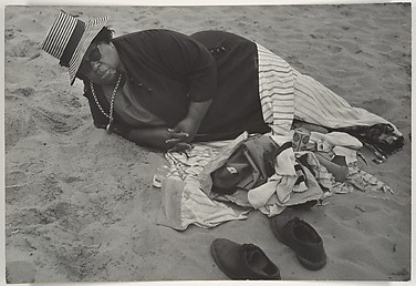 [Beach Scene: Woman Wearing Striped Hat and Dark Jacket, Coney Island, New York]