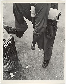 [Street Scene: Man Resting Foot on Lip of Trashcan, New York City]