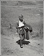 A wounded soldier treks six miles to a hospital behind the front lines after the Chinese victory at Taierhchwang, April