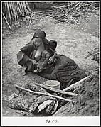 After the bombardments, this mother is one of many who keep alive by eating herbs and roots, Taiherhchwang