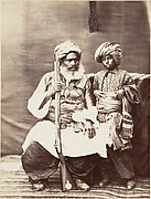 [Turbaned Man Holding Rifle with Boy Alongside]