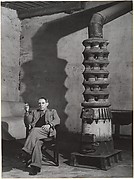 [Picasso Near the Stove in His Workshop, rue des Grands Augustins, Paris]