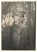 [Kiki Wearing Hat and Scarf of Gazelle Leather]