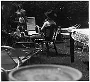 [Girl Standing, Boy in Chair]