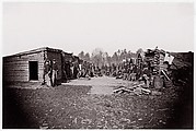 [Winter Quarters, troops with row of cabins].  Brady album, p. 128