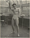 [Male Model Posed Pulling a Rope in Anna Huntington's Rooftop Studio]